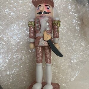 Sparkling Rose Gold Nutcracker Holiday Figurine - Brand Unknown pink glitter